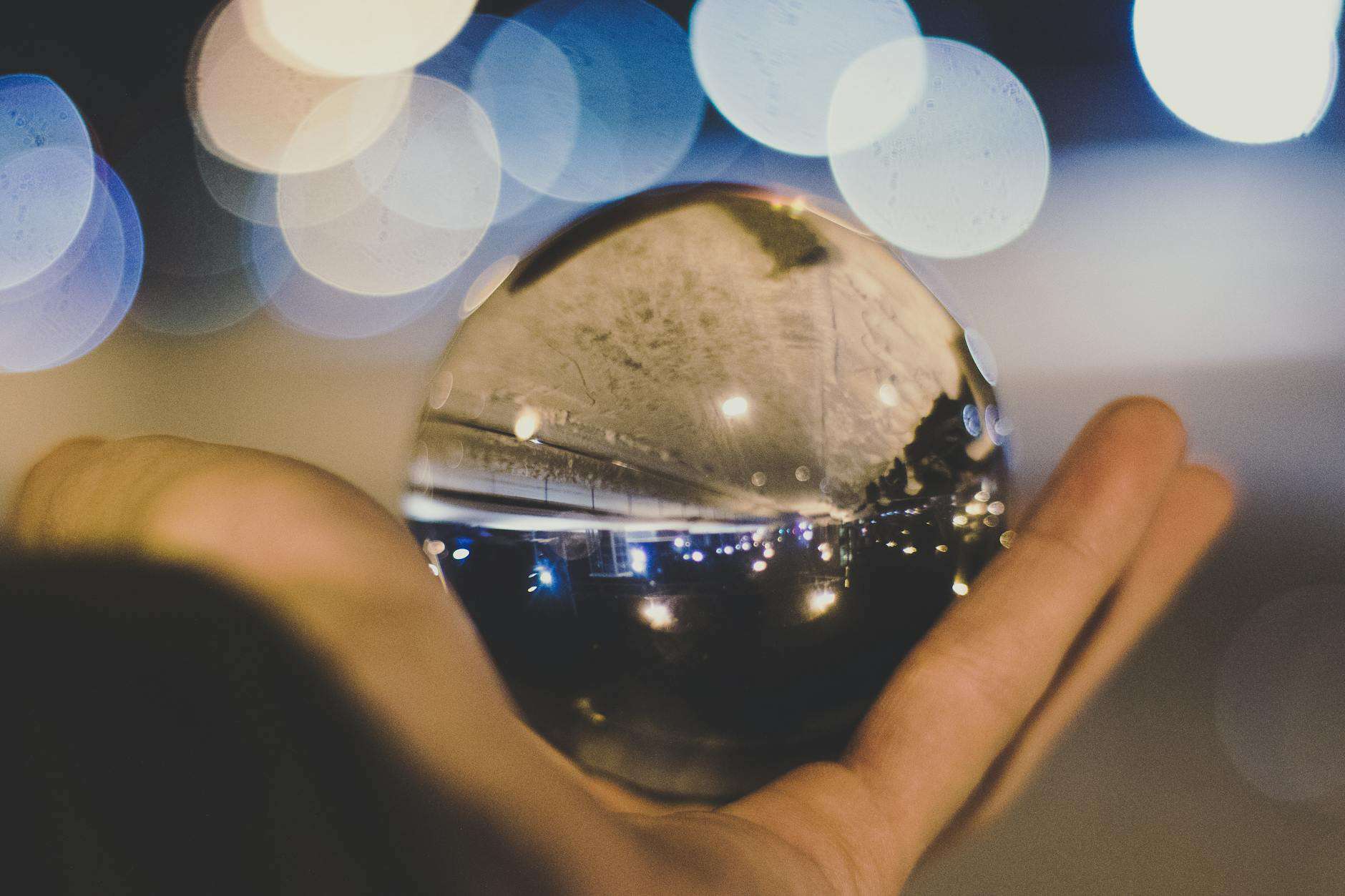 crystal ball on person s hand